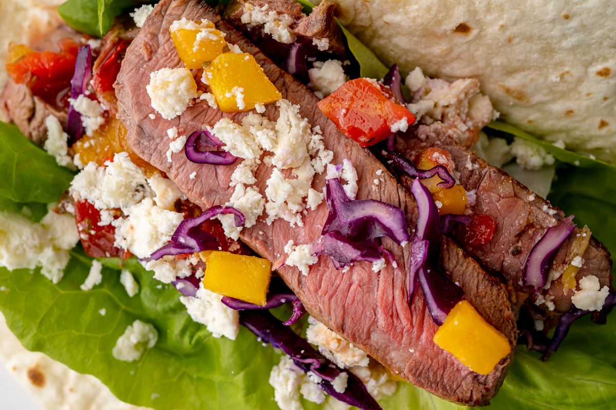 close up shot of sliced steak on a taco