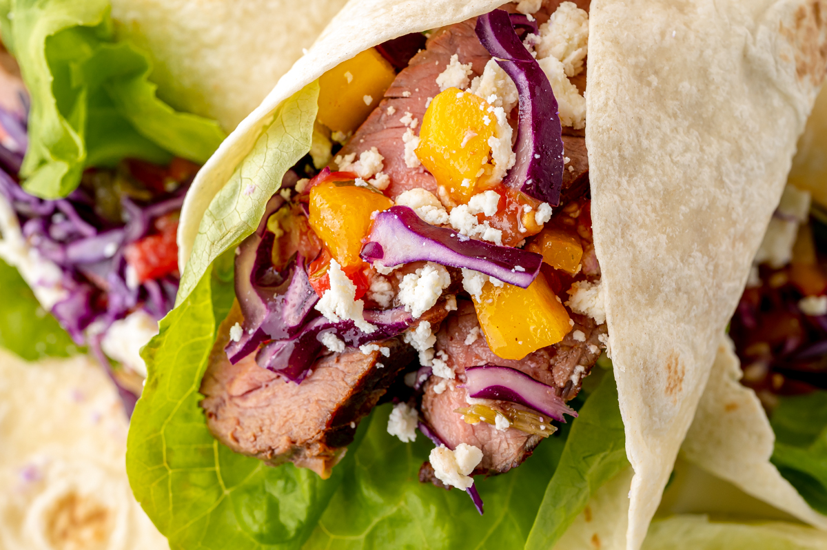 close up angled shot of tropical beef taco