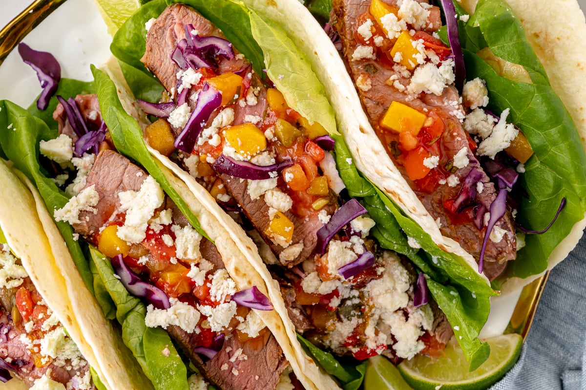 close up overhead shot of platter of tropical beef tacos