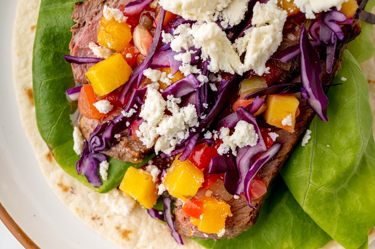 close up overhead shot of steak taco on plate