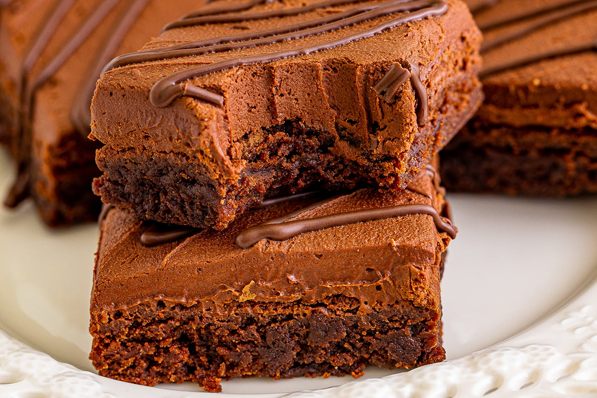 close up of bite taken out of stack of brownies