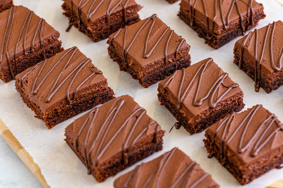 angled shot of cut bailey's brownies on parchment paper