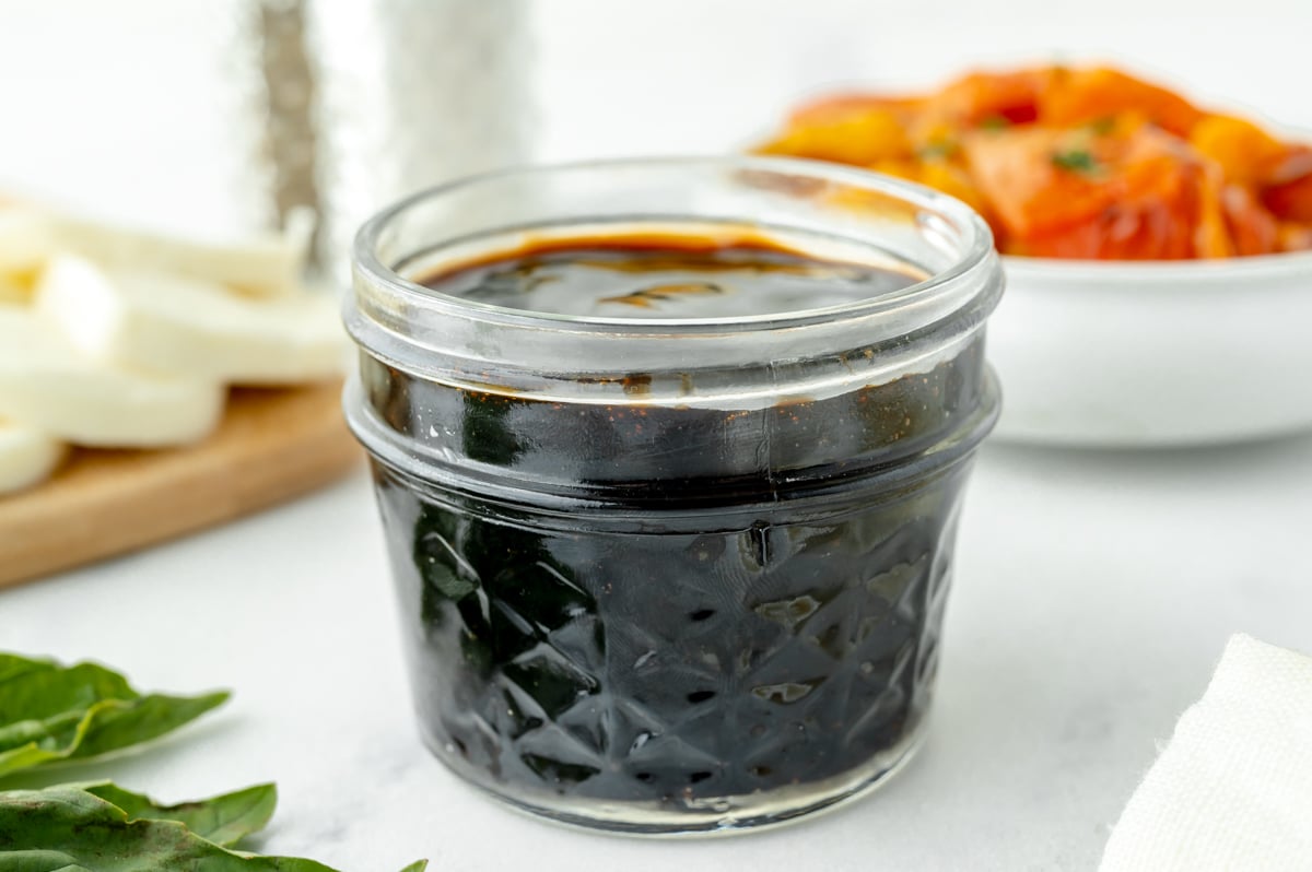 angled shot of jar of balsamic reduction