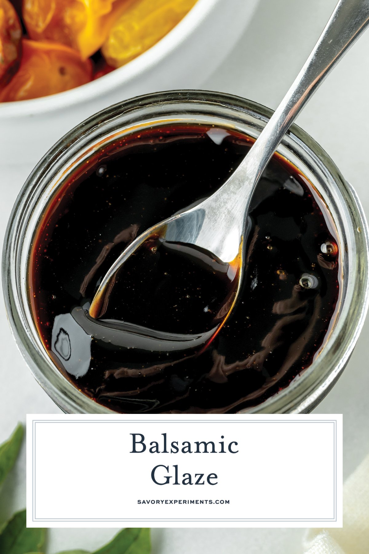 overhead shot of spoon in jar of balsamic glaze with text overlay