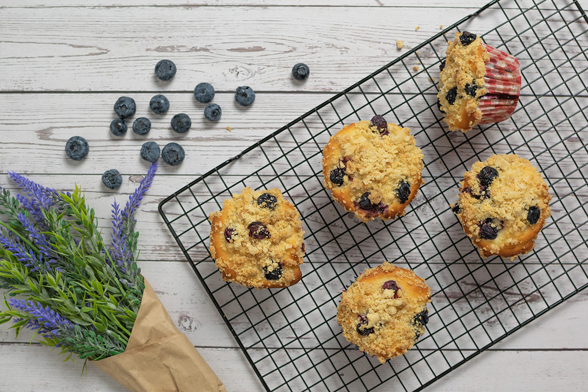 overhead shot of blueberry muffins on cooling rack