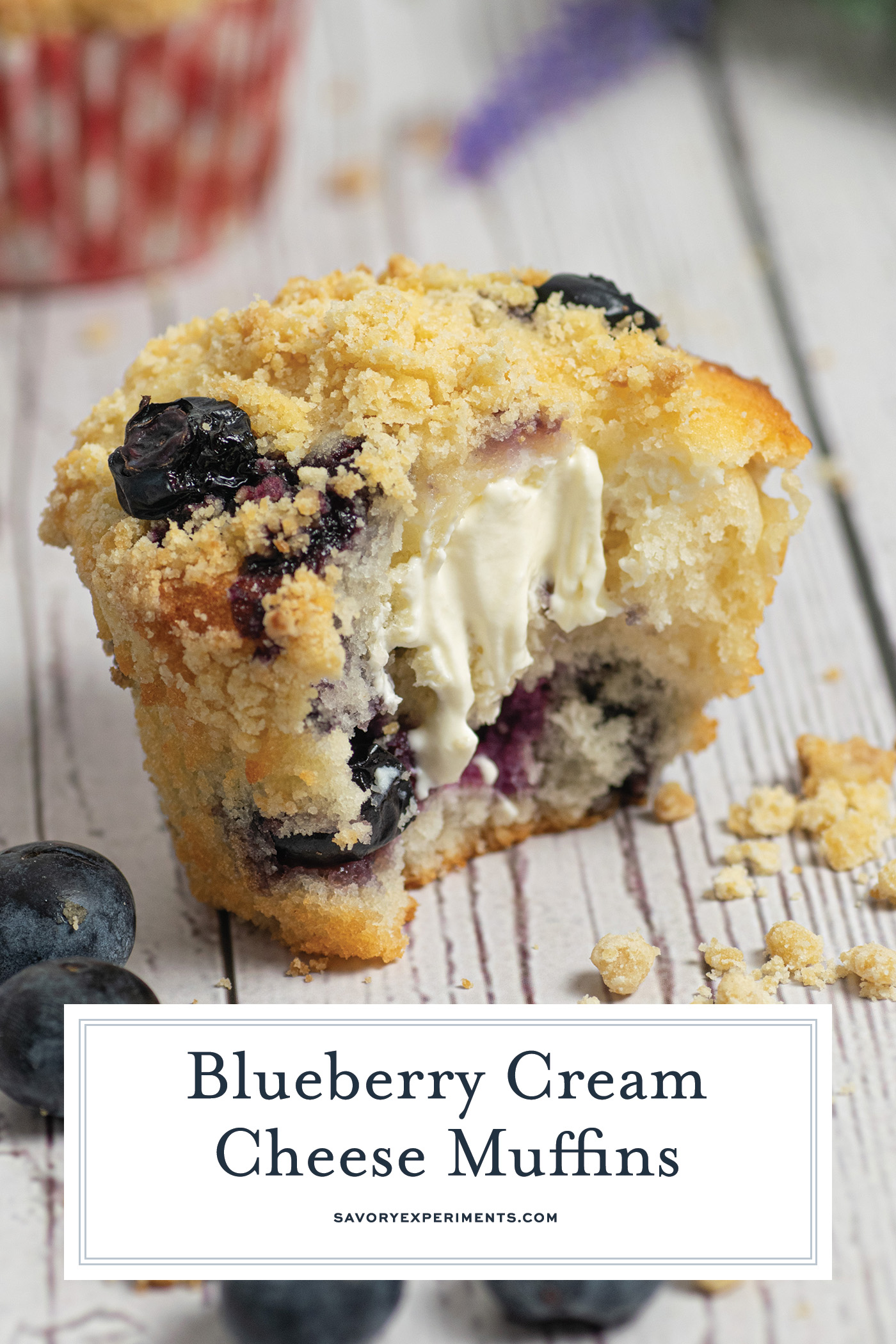 bite taken out of blueberry cream cheese muffins with text overlay