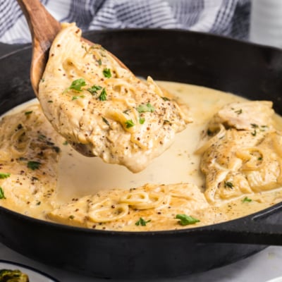 angled shot of spatula removing chicken dijon from pan