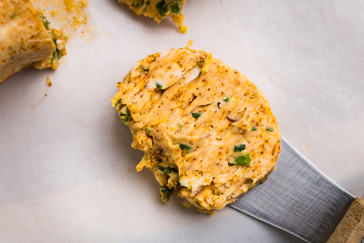 close up overhead shot of pat of cowboy butter on knife