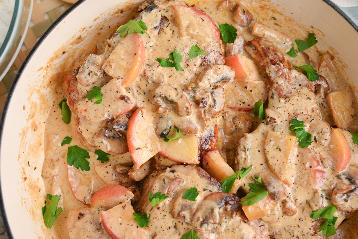 close up overhead shot of pan of creamy apple pork chops