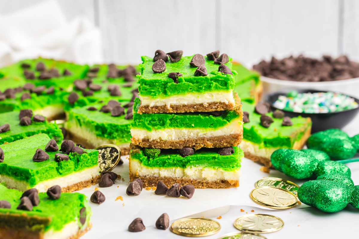 straight on shot of stack of three grasshopper cheesecake bars