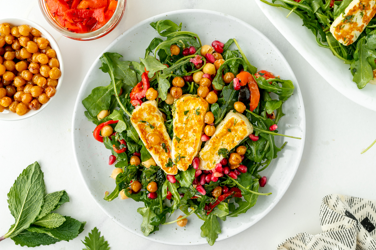 overhead shot of fried halloumi salad on plate