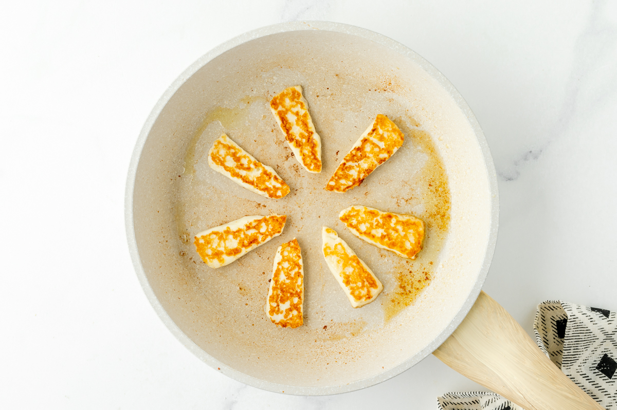 halloumi cheese frying in pan