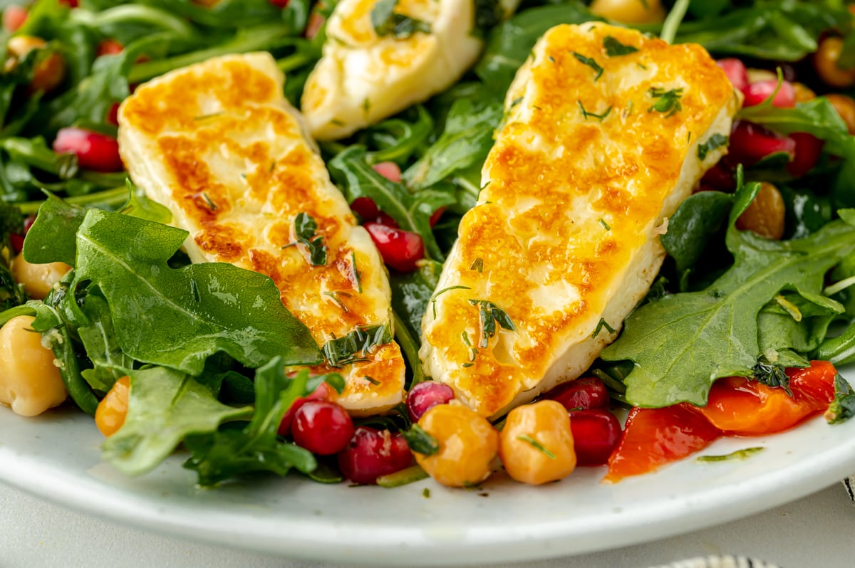 close up straight on shot of fried halloumi salad