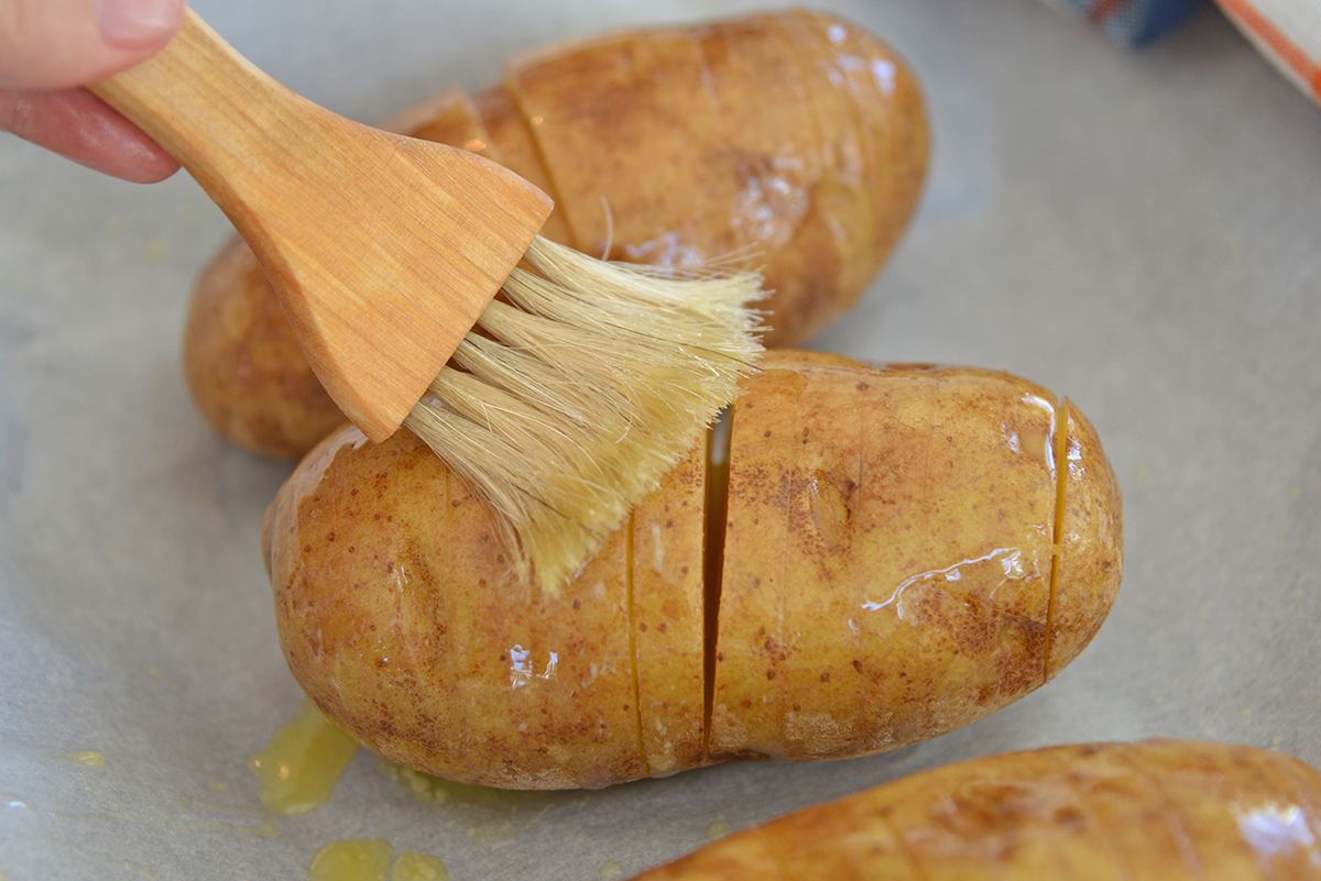 olive oil brushed onto sliced potato