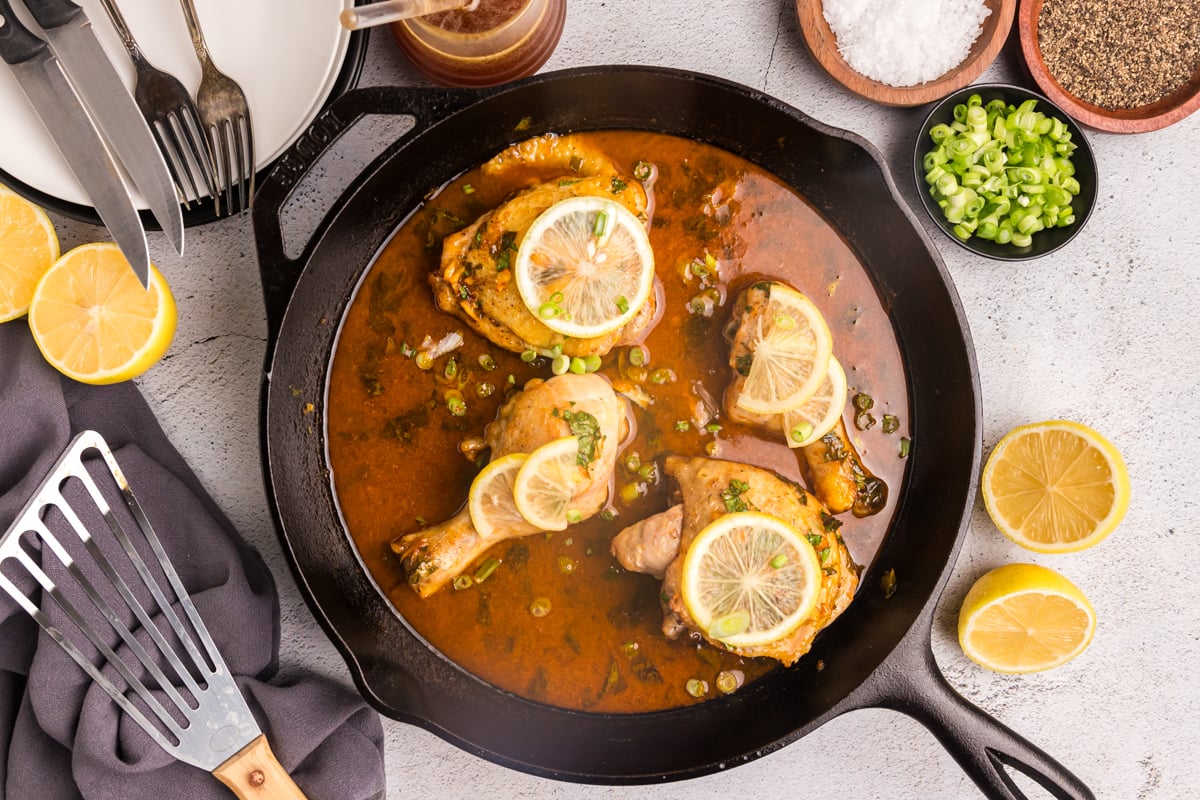 overhead shot of skillet of honey lemon garlic chicken