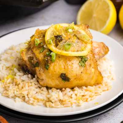 angled shot of plate of rice with honey lemon garlic chicken