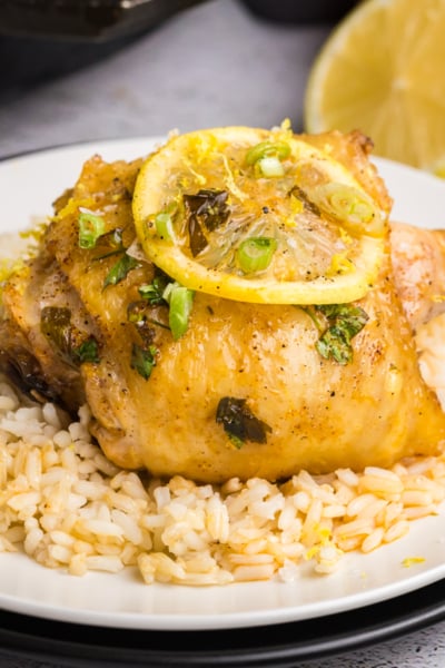 angled shot of plate of rice with honey lemon garlic chicken