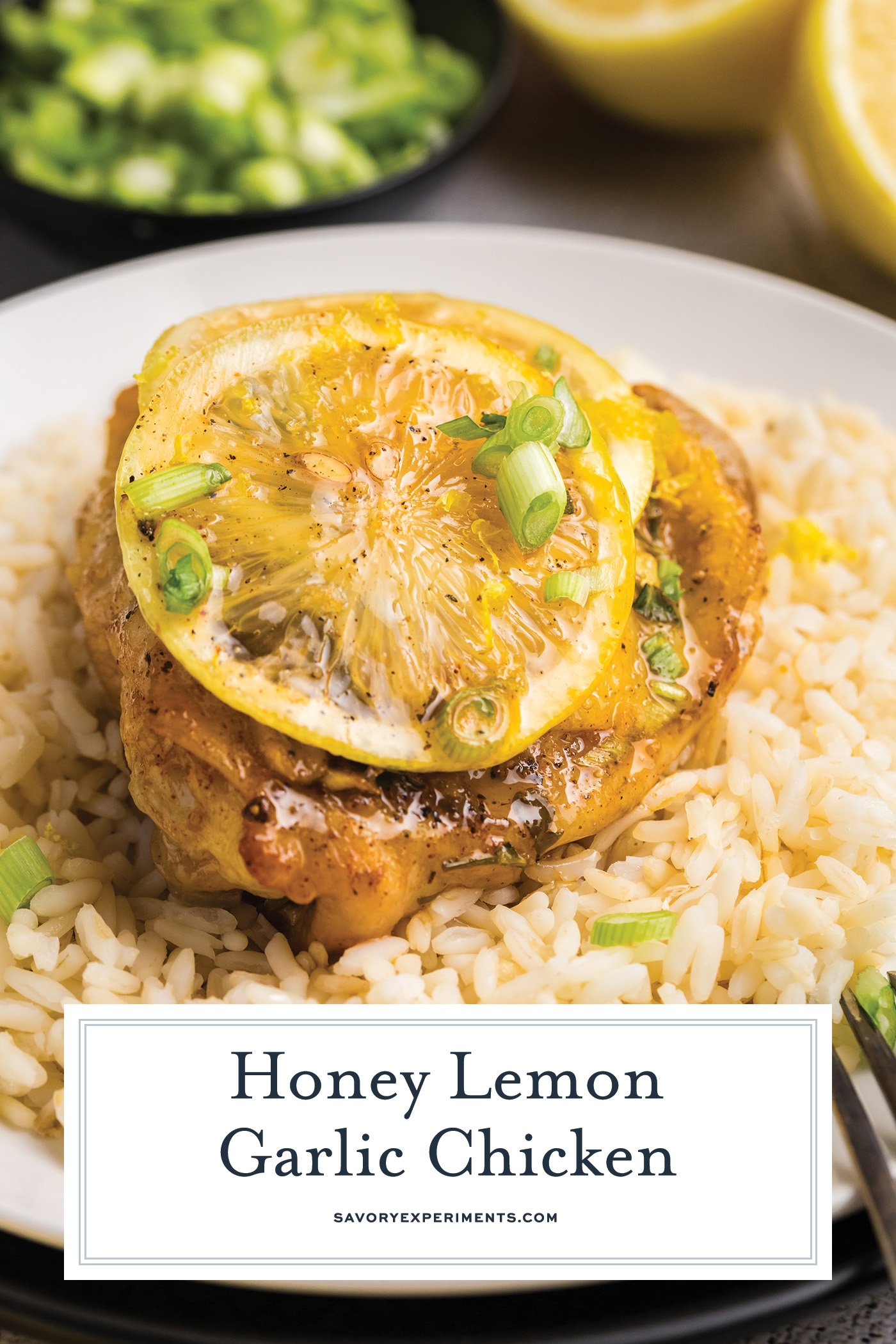 angled shot of lemon chicken thigh over rice with text overlay