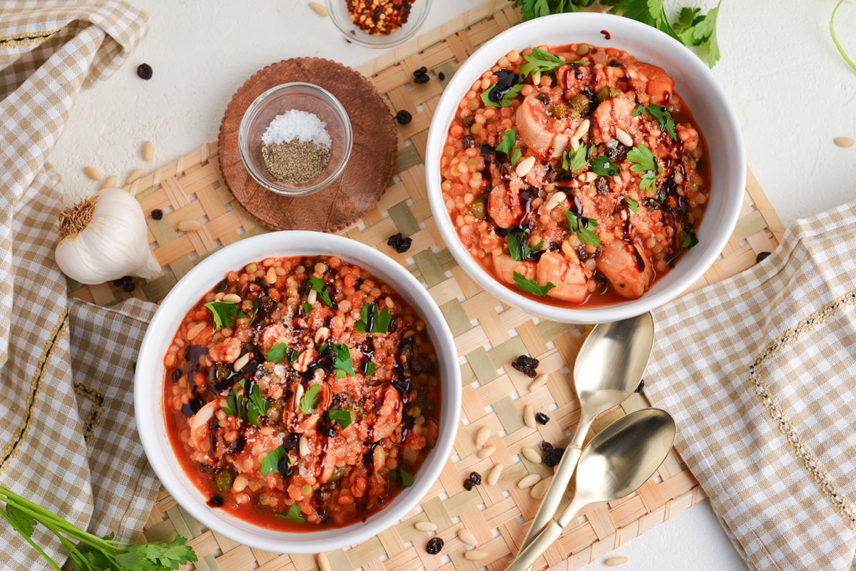 overhead shot of two bowl of italian seafood stew