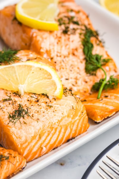 angled shot of lemon dill salmon on serving tray