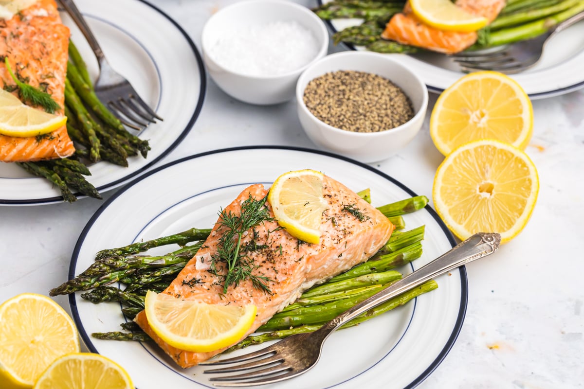 angled shot of plate with salmon and asparagus