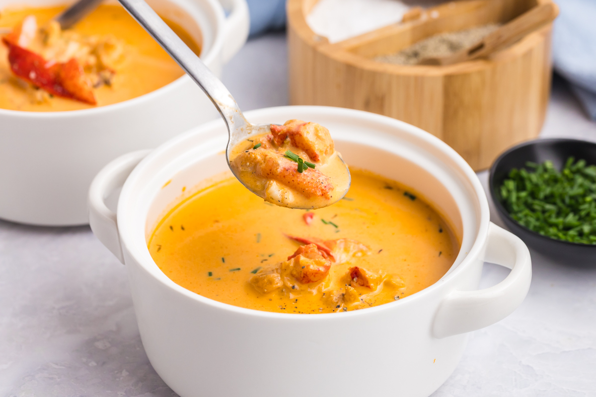 spoon over bowl of lobster bisque