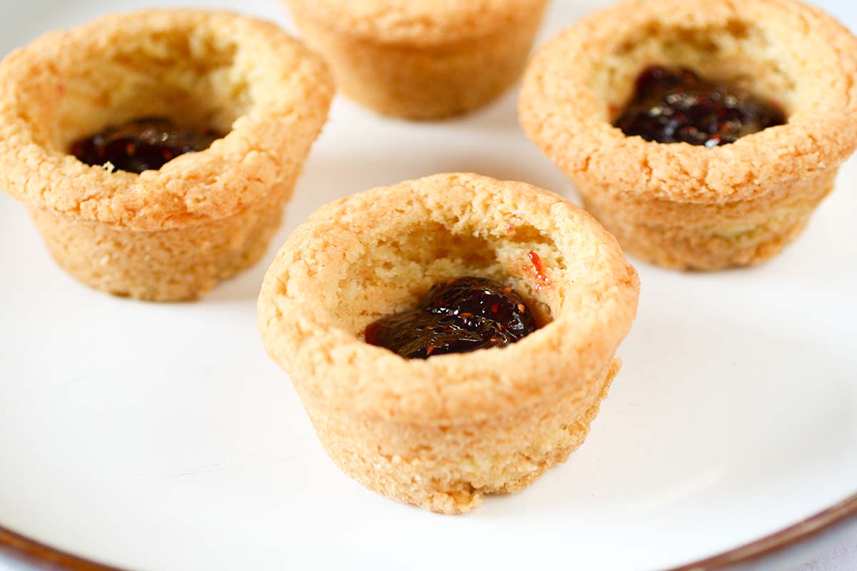 raspberry jam in sugar cookie cups