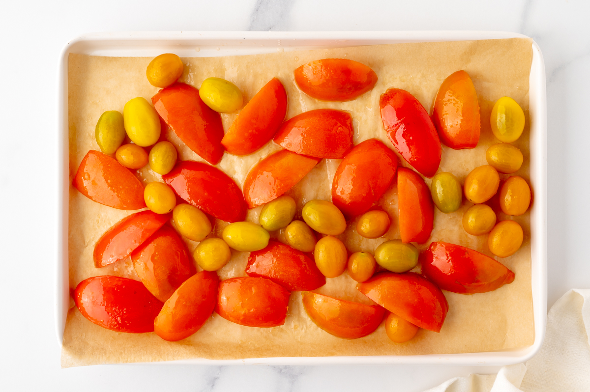 overhead shot of tomatoes on baking sheet