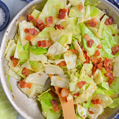 Fried Cabbage with Bacon in a Skillet