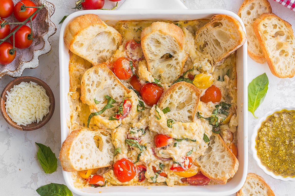 overhead shot of crostini's in dish of hot caprese dip