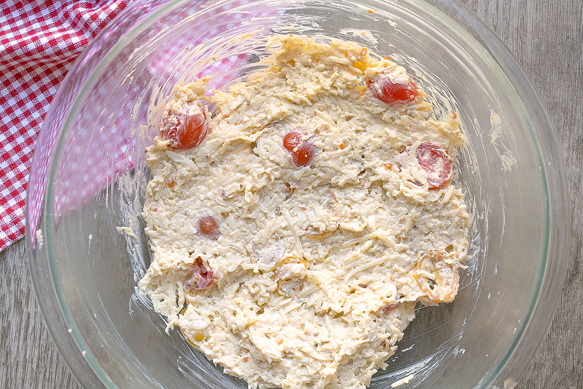 caprese dip ingredients mixed into bowl