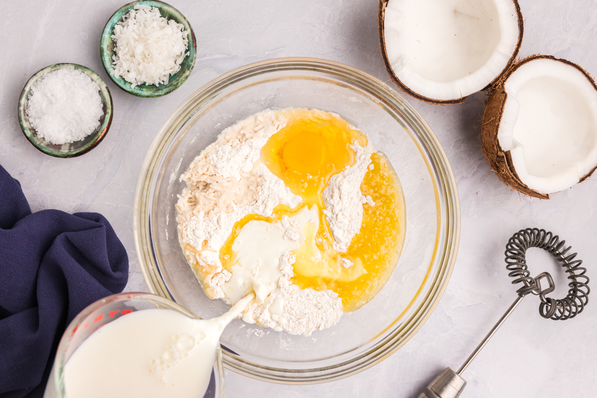 milk poured into pancake batter