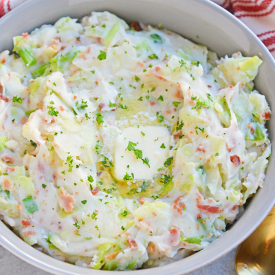 Overhead of iris colcannon in a bowl and topped with butter