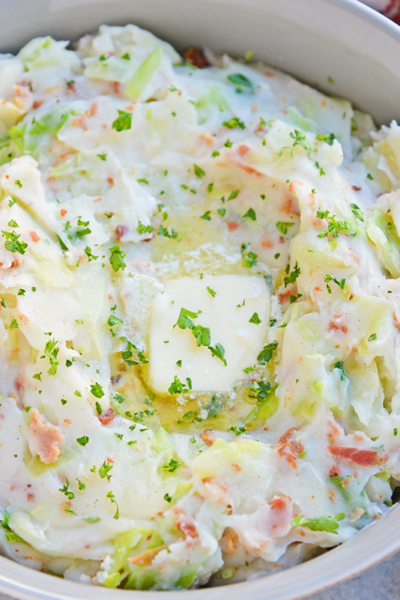 Overhead of iris colcannon in a bowl and topped with butter