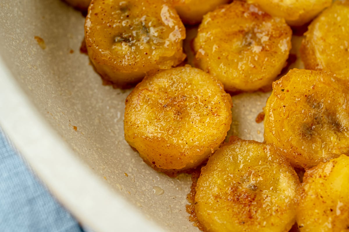 close up overhead shot of fried bananas in pan