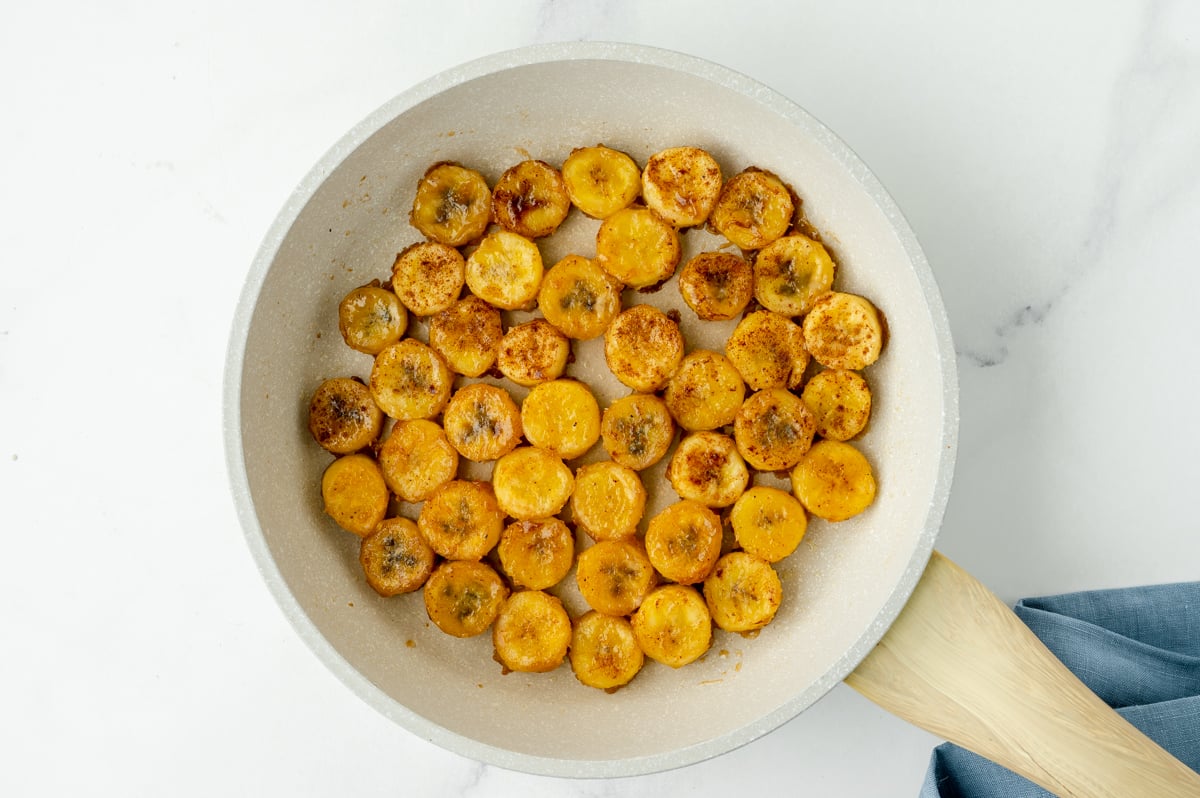 overhead shot of fried bananas in pan