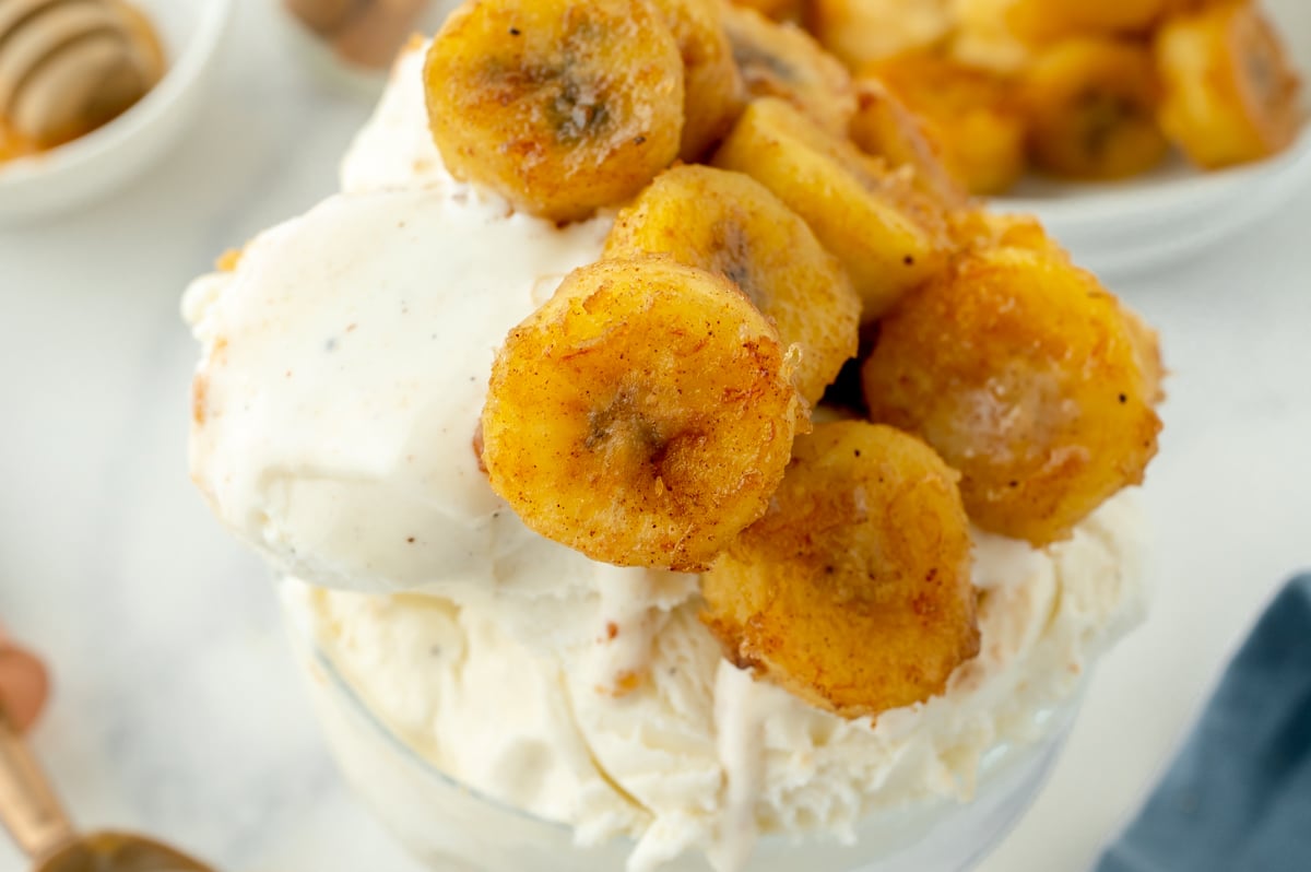 overhead shot of fried bananas on ice cream