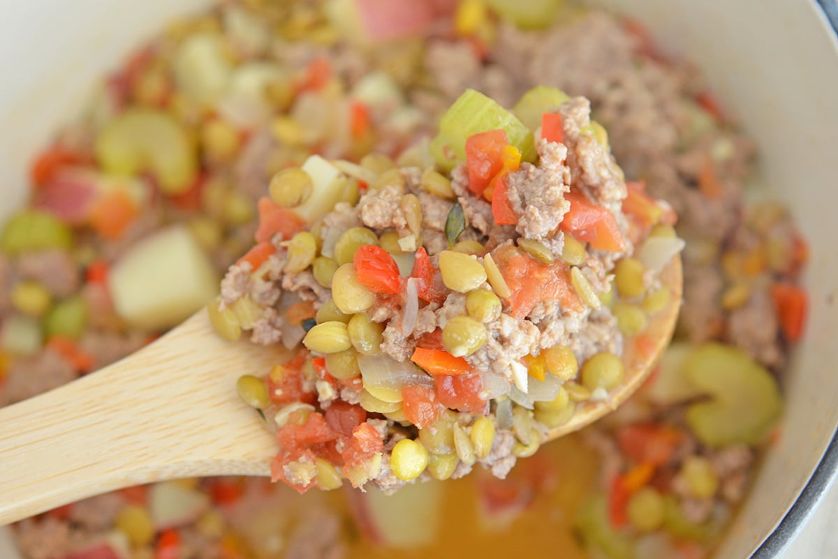 close up of lamb stew on wooden spoon