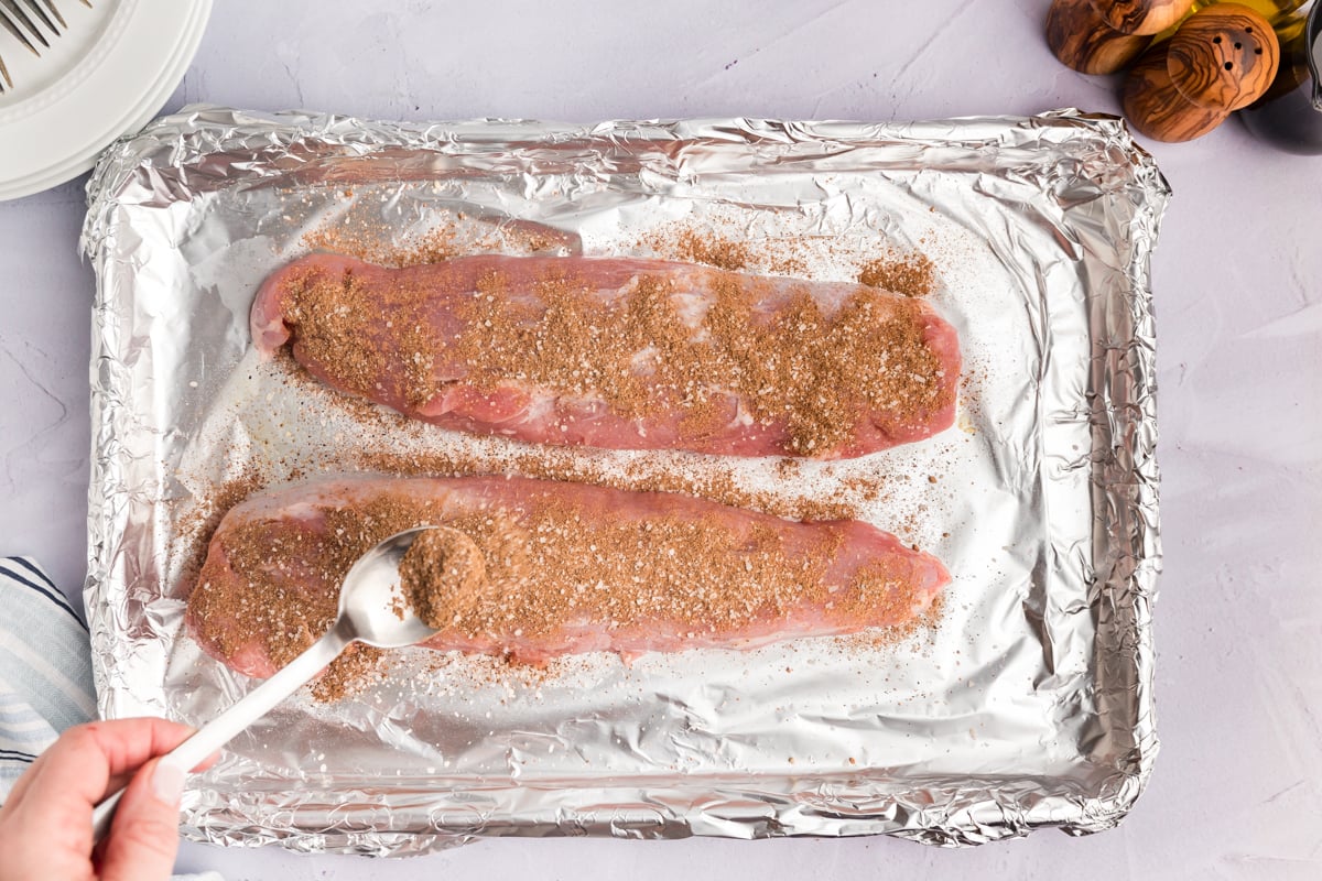 overhead shot of two pork tenderloins with dry rub seasoning