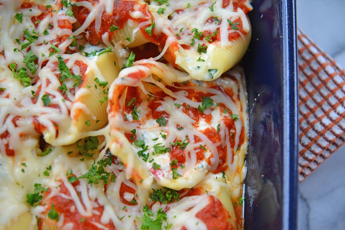 close up overhead shot of baked spinach stuffed shells