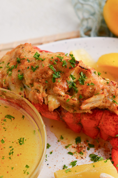 angled shot of plate of stuffed lobster tail