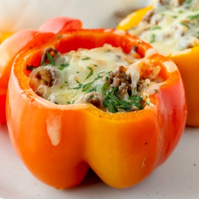 angled shot of red stuffed pepper on plate