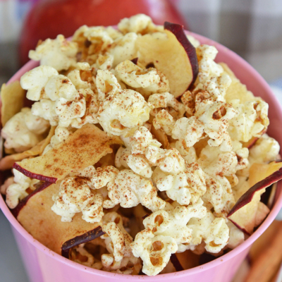 close up angled shot of bucket of apple cinnamon popcorn