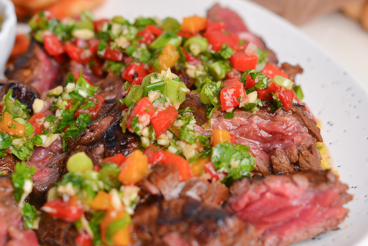 close up of bavette sauce on sliced steak