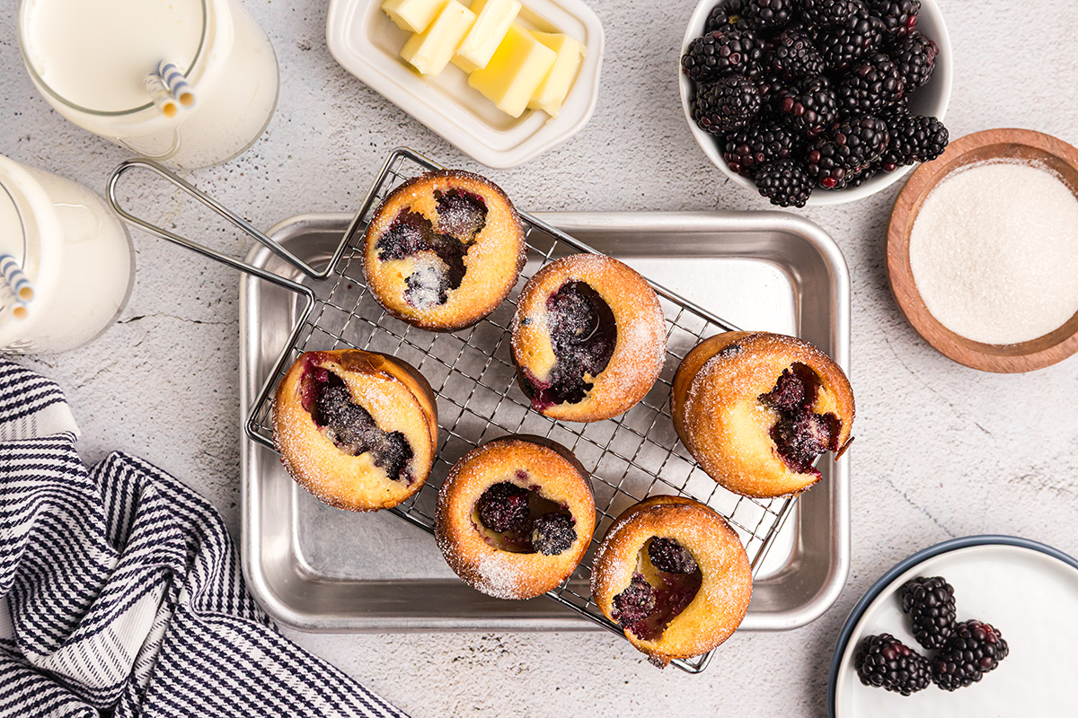 overhead shot of blackberry popovers on wire rack