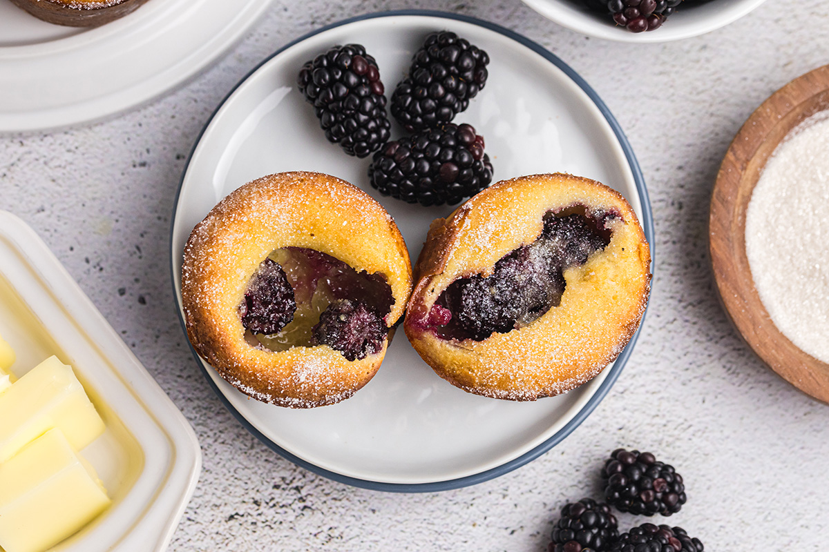 overhead shot of two blackberry popovers on plate