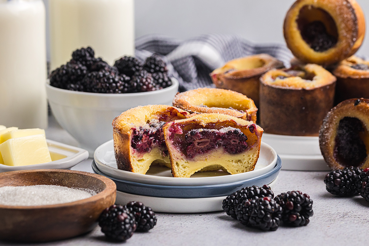 black berry popover cut in half on plate