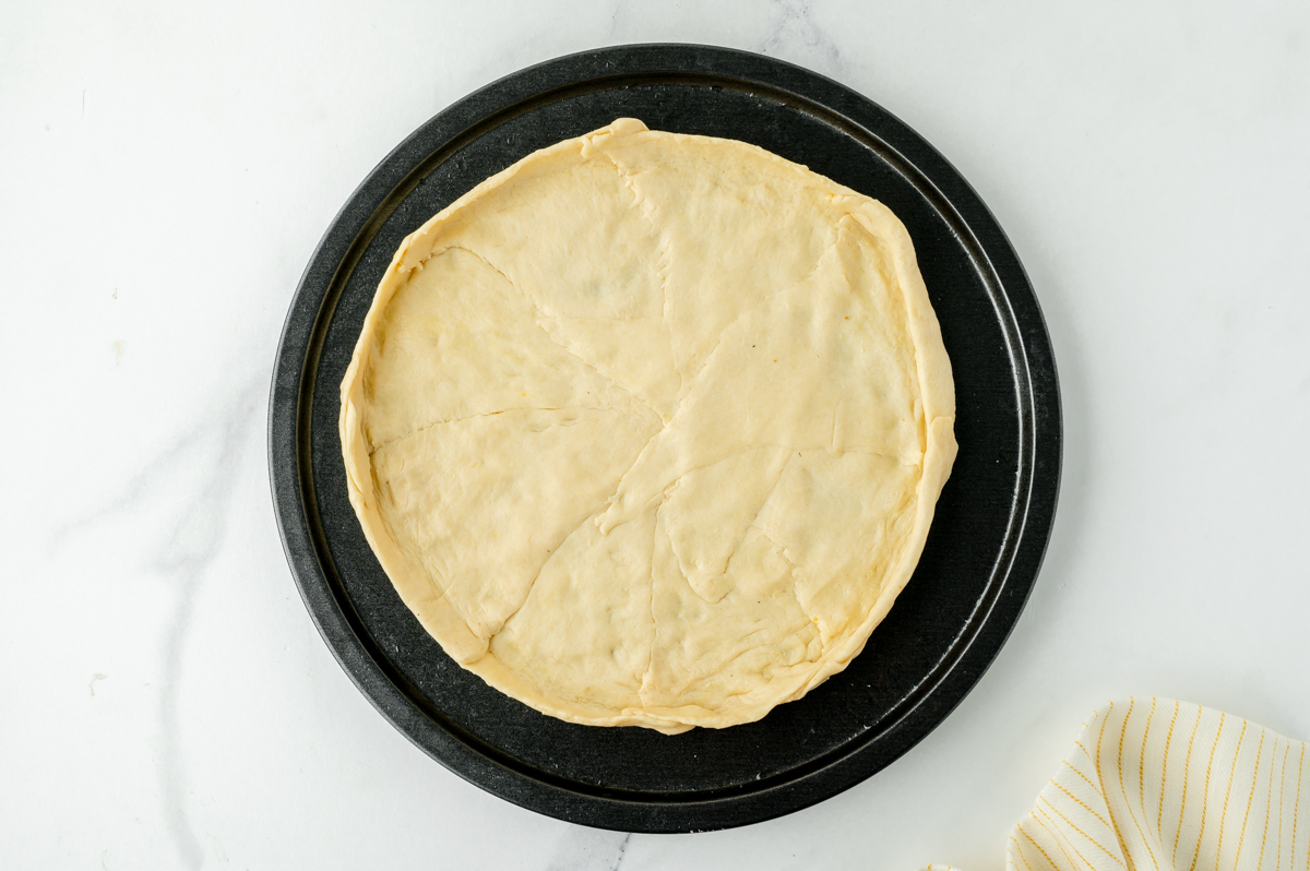 overhead shot of raw pizza crust