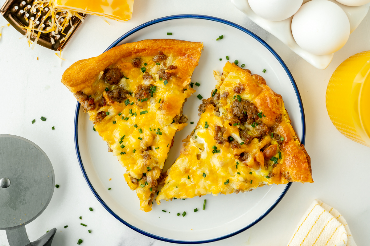 overhead shot of two slices of breakfast pizza on a plate