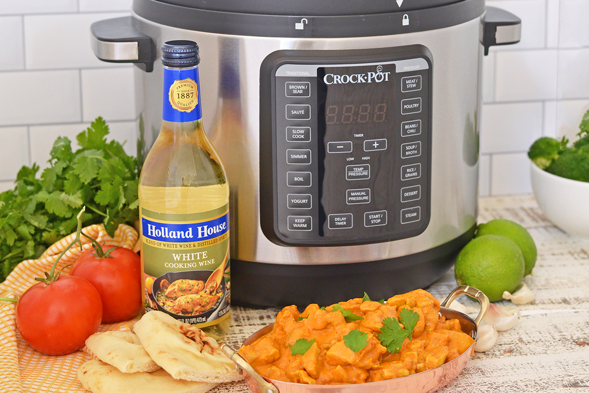 straight on shot of indian butter chicken with instant pot and white cooking wine